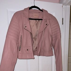 Pink leatherette jacket size large, zippers all work. Only worn a few times.